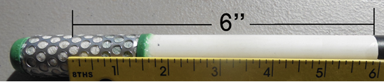 PVC pipe with sensor attached to one end and black electrical tape at the other end. A ruler shows the distance between the two is 6 inches.