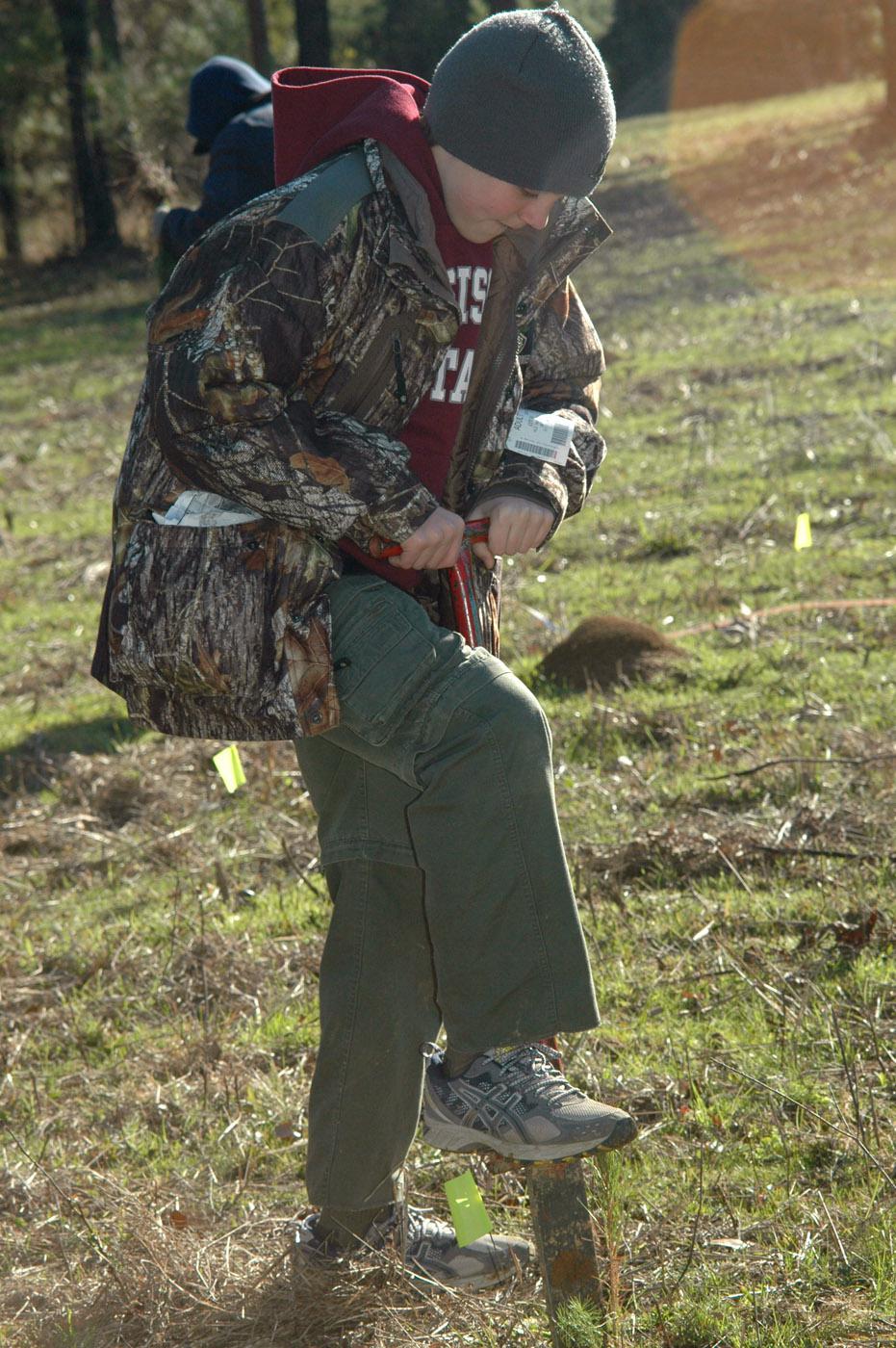 Phillip Talley helped to plant one-third an acre of pine seedlings during the Feb. 11, 2012, workshop held at Hood Boy Scout Camp in Hazlehurst to help members of the Andrew Jackson Council earn their forestry merit badges. (Photo by Susan Collins-Smith)