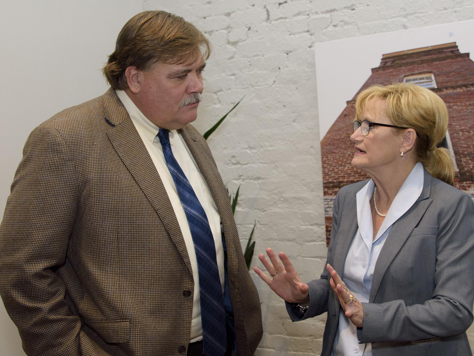 Gary Jackson, director of the Mississippi State University Extension Service, discusses the 2016 MSU Row Crop Short Course with Mississippi Commissioner of Agriculture and Commerce Cindy Hyde-Smith on Dec. 6, 2016. (Photo by MSU Extension Service/Kevin Hudson)