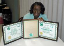 Longtime Warren County 4-H club leader Gloria Smith displays certificates she received from the state 4-H program and the Mississippi Volunteer Leaders Association for her service to youth. (Photo by Patti Drapala)