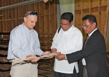 Rubin Shmulsky, head of Mississippi State University's Department of Forest Products, explains the process of using lower quality wood fiber to make structural beams to Edilberto DeLuna and Asterio Saliot, members of an agricultural delegation from the Philippines, visiting campus on May 28, 2013. (Photo by MSU Ag Communications/Kat Lawrence)