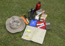 Being prepared for outdoor adventures includes carrying a hiking kit with a map, compass, flashlight, knife, whistle, first-aid items, water and protection from the seasonal elements. (Photo by MSU Ag Communications/Kevin Hudson)