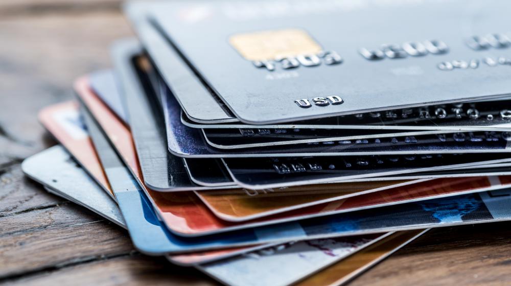 Credit cards laying on a table.