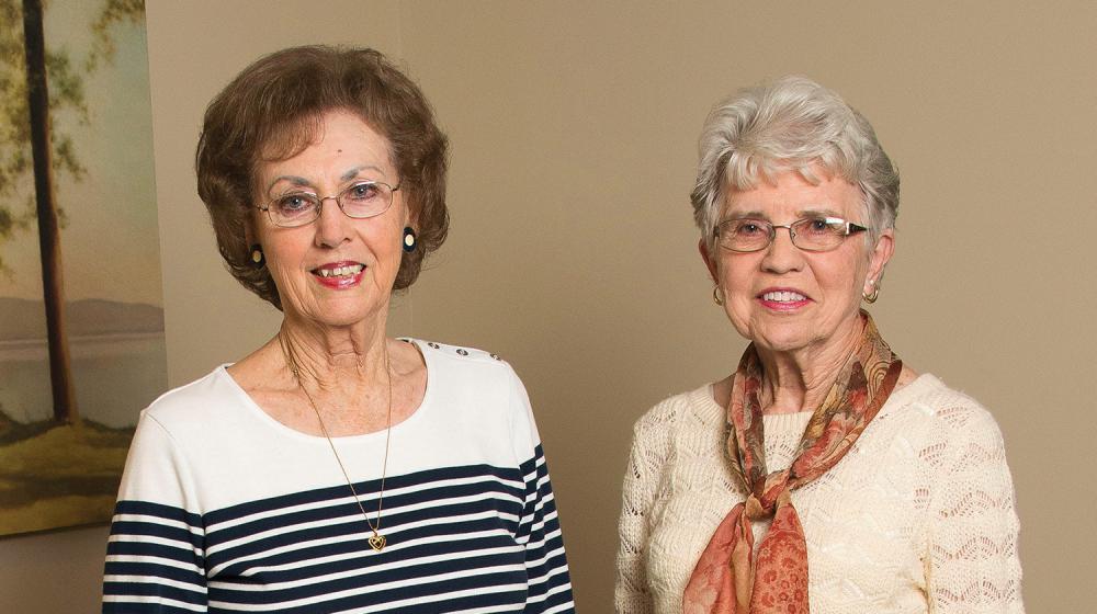 Two women philanthropists smiling.