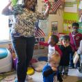 Child-care provider Dana Smith leads a dance session with Levi Mills, Carmus Batemon, Jakob Reyes, Auston Simpson and Langston Simpson at her in-home child-care program in Olive Branch. Busy Bundles of Joy Learning Center was recently recognized as a five-star center by the in-home Quality Rating and Improvement System. (Photo by MSU Extension Service/Alicia Barnes)