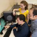 Dr. Henry Wan (far right), an associate professor at Mississippi State University's College of Veterinary Medicine, works with two of his students on his Antigen program in support of influenza vaccine research. (Photo by MSU College of Veterinary Medicine/Tom Thompson).