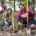 Landscape architecture graduate students Wanrong Tan from Shanghai, China, and Amer Mahaslin from Amman, Jordan, install plants along the Pilot Club Music Trail in McKee Park on Oct. 18, 2013. The Pilot Club Music Trail consists of playground versions of musical instruments for families to enjoy. (Photo by MSU Ag Communications/Scott Corey)