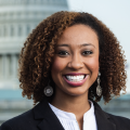 Headshot of a young black woman in business attire.