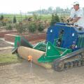 Barry Stewart, associate professor of plant and soil sciences at Mississippi State University, uses a sod installer to roll out Mississippi Pride turf near the new rose garden at the R.R. Foil Plant Science Research Center on the MSU North Farm. Mississippi Pride, which is known for its color, density and durability, is one of several popular grasses developed by MSU researchers.