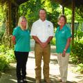 Brett Rushing, an assistant Extension and research professor at the Mississippi State University Coastal Plain Branch Experiment Station, works with Neeley Norman, left, and Sarah Kountouris on the Wildflower Trails of Mississippi, a program coordinated by Keep Mississippi Beautiful intended to turn Mississippi roadsides into pollinator habitats and tourist attractions. Norman is assistant director of Keep Mississippi Beautiful, and Kountouris is director. (Photo by MSU Extension Service/Kat Lawrence)