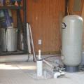 A well water system in a storage room.